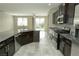 Open kitchen layout with stainless steel appliances and granite countertops at 1617 Meadow Bluffs Ave, Henderson, NV 89014