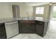 Kitchen island featuring a sink and stainless steel dishwasher at 1617 Meadow Bluffs Ave, Henderson, NV 89014