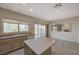 Well-lit kitchen with island and sink with sliding glass door and view of the fireplace in the other room at 1687 Wellington Springs Ave, Henderson, NV 89052