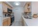 Bright kitchen featuring stainless steel appliances, tile backsplash and lots of cabinet storage at 205 E Harmon Ave # 121, Las Vegas, NV 89169