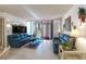 Inviting living room featuring tile floors, two sofas and access to balcony at 205 E Harmon Ave # 121, Las Vegas, NV 89169