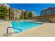 Relaxing community pool surrounded by lounge chairs, perfect for leisure at 205 E Harmon Ave # 121, Las Vegas, NV 89169