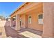 Comfortable covered back patio with access to the home, ideal for outdoor seating and entertaining at 211 Crown Imperial St, Henderson, NV 89074