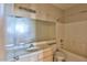 Bathroom featuring a vanity with large mirror and shower-tub combination at 211 Crown Imperial St, Henderson, NV 89074