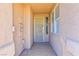 Covered front porch with security door and window at 211 Crown Imperial St, Henderson, NV 89074