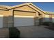 Single-story home featuring a two-car garage and a well-maintained driveway at 211 Crown Imperial St, Henderson, NV 89074