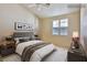 Staged primary bedroom featuring a ceiling fan, and neutral colored walls at 211 Crown Imperial St, Henderson, NV 89074