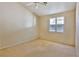Primary bedroom featuring a ceiling fan, and neutral colored walls at 211 Crown Imperial St, Henderson, NV 89074