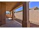Covered patio with stucco support columns and rock landscaping at 211 Crown Imperial St, Henderson, NV 89074