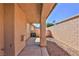 Exterior view of a covered patio with a stucco wall at 211 Crown Imperial St, Henderson, NV 89074