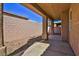 Covered patio featuring a stucco wall and stone landscaping at 211 Crown Imperial St, Henderson, NV 89074