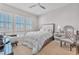 Bright bedroom featuring large windows, a comfortable bed, and contemporary decor at 2503 Cracked Stone St, Henderson, NV 89044