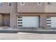 Townhome with a two-car garage featuring modern paneled doors at 2503 Cracked Stone St, Henderson, NV 89044