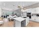 Open concept kitchen with an island, stainless steel appliances and a breakfast bar at 2503 Cracked Stone St, Henderson, NV 89044