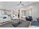 Open concept living room with modern furnishings and access to outdoor space at 2503 Cracked Stone St, Henderson, NV 89044