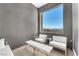 Cozy sitting area with comfortable seating and a large window offering scenic views at 2503 Cracked Stone St, Henderson, NV 89044
