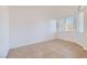 Clean bedroom featuring tile flooring and natural light from the windows at 2617 Tanagrine Dr, North Las Vegas, NV 89084