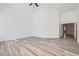 Spacious bedroom with wood-look flooring and neutral paint, with ample natural light at 2617 Tanagrine Dr, North Las Vegas, NV 89084