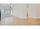 Spacious dining room with tile flooring, chandelier, and bright windows at 2617 Tanagrine Dr, North Las Vegas, NV 89084