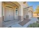 Inviting front entrance with arched entryway and double doors, plus views of the three car garage at 2617 Tanagrine Dr, North Las Vegas, NV 89084