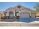 Charming single-story home featuring a three-car garage and well-maintained landscaping at 2617 Tanagrine Dr, North Las Vegas, NV 89084