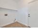 Minimalist laundry room with a tile floor and convenient shelving at 2617 Tanagrine Dr, North Las Vegas, NV 89084