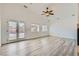 Bright living room features modern flooring, vaulted ceilings, and glass patio doors at 2617 Tanagrine Dr, North Las Vegas, NV 89084