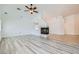 Bright living room showcases fireplace, ceiling fan, and neutral wall color at 2617 Tanagrine Dr, North Las Vegas, NV 89084