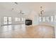 View of living room showcasing fireplace, patio doors, and tile flooring at 2617 Tanagrine Dr, North Las Vegas, NV 89084