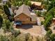 View of the house with surrounding tall trees and retaining walls at 264 Crestview Dr, Las Vegas, NV 89124