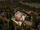 Aerial view of the home surrounded by tall trees and other neighborhood houses at 264 Crestview Dr, Las Vegas, NV 89124