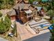 Aerial view of a home with a tiered driveway, mature landscaping, and a stone facade at 264 Crestview Dr, Las Vegas, NV 89124