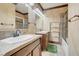Spacious bathroom featuring double vanity with marble counters, tiled shower and tub at 264 Crestview Dr, Las Vegas, NV 89124