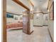 Open doorway into a bedroom; neutral walls, tiled floor, and framed pictures on wall at 264 Crestview Dr, Las Vegas, NV 89124