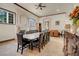 Spacious dining room featuring a large table, fireplace, and built-in wooden cabinet at 264 Crestview Dr, Las Vegas, NV 89124