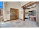 Spacious entryway features large wooden doors and decorative tiled flooring leading into a cozy living area at 264 Crestview Dr, Las Vegas, NV 89124