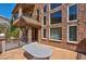 The house features expansive windows, stone accents, and an inviting outdoor seating area at 264 Crestview Dr, Las Vegas, NV 89124