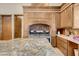 Close up on a gourmet kitchen with detailed custom range hood and granite counters at 264 Crestview Dr, Las Vegas, NV 89124