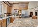 Spacious kitchen features granite countertops, stainless steel appliances, and custom wood cabinetry at 264 Crestview Dr, Las Vegas, NV 89124