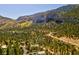 Beautiful mountainside filled with trees and winding roads under a clear blue sky at 264 Crestview Dr, Las Vegas, NV 89124