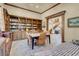 Inviting library featuring a built-in bookcase, tiled floors, and a cozy reading nook at 264 Crestview Dr, Las Vegas, NV 89124