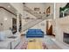 Spacious living room with a staircase, fireplace, and comfortable seating at 264 Crestview Dr, Las Vegas, NV 89124