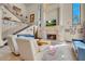 Bright living room with stone fireplace, comfortable seating, and staircase at 264 Crestview Dr, Las Vegas, NV 89124