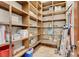 Large walk-in pantry with abundant wooden shelving, perfect for organization and storage at 264 Crestview Dr, Las Vegas, NV 89124