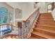 Beautiful staircase with wood steps, iron railing, and lots of natural light at 264 Crestview Dr, Las Vegas, NV 89124