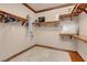 Walk-in closet with custom shelving, hanging racks, and neutral paint at 264 Crestview Dr, Las Vegas, NV 89124