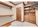 Walk-in closet with custom wooden shelving and drawers at 264 Crestview Dr, Las Vegas, NV 89124