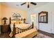 Comfortable bedroom with wood floors, a ceiling fan, and natural lighting at 2705 Cornish Hen Ave, North Las Vegas, NV 89084