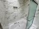 Close-up of bathtub with shower features marble tile surround and shower niche at 2964 Juniper Hills Blvd # 202, Las Vegas, NV 89142