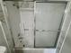 Clean white bathtub with sliding glass doors and chrome shower head at 2964 Juniper Hills Blvd # 202, Las Vegas, NV 89142